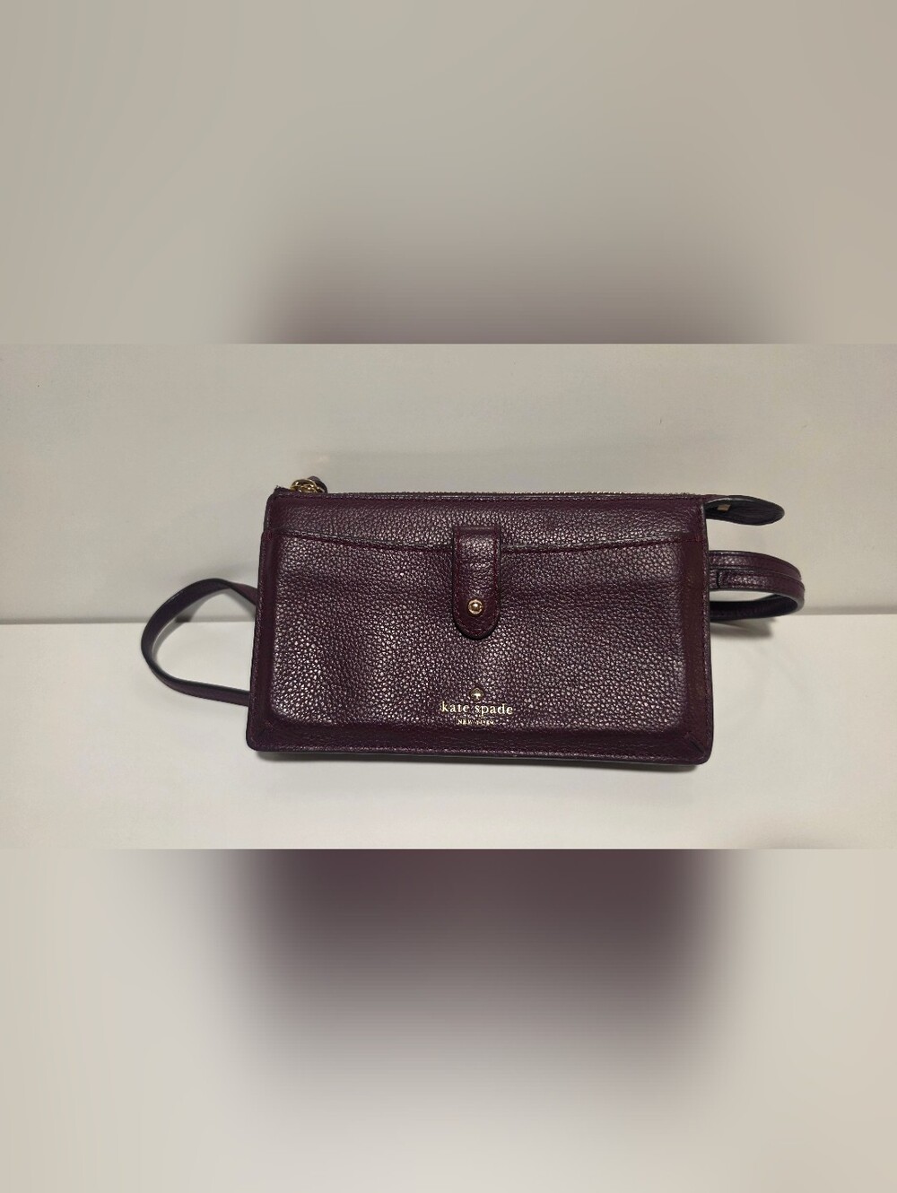 kate spade Pebbled Leather Crossbody Wallet in Plum with Gold Hardware